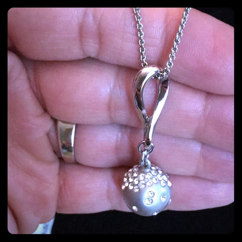 Necklace with round pendant.